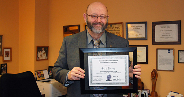 Bruce Pomeroy, Director of the Office of Accessibility Resources and Services (OARS) was recently recognized for his "distinguished service" to the Greensboro Mayor's Committee for Persons with Disabilities by Mayor Nancy Vaughan and the committee.