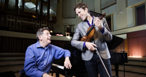 Philip Glass, one of the most celebrated composers of the modern era, performs with violinist Timothy Fain Tuesday, April 14, at UNCG. The performance begins at 8 p.m. in Aycock Auditorium.